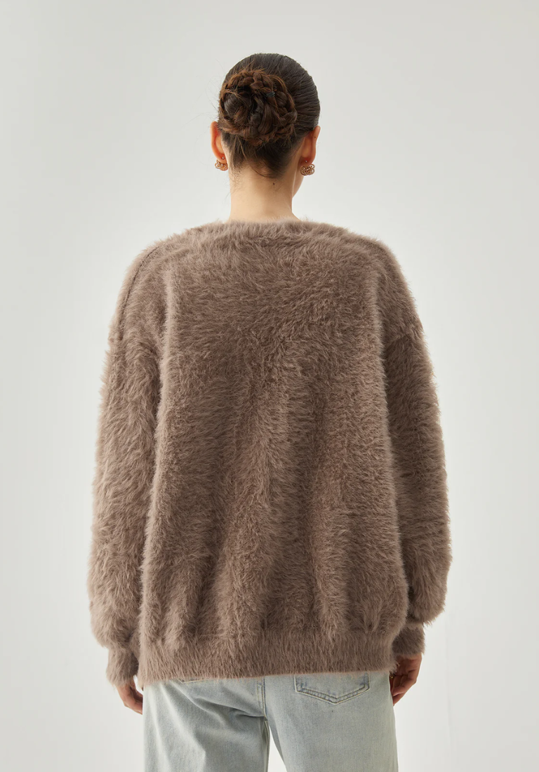 Fuzzy vest met knoopjes